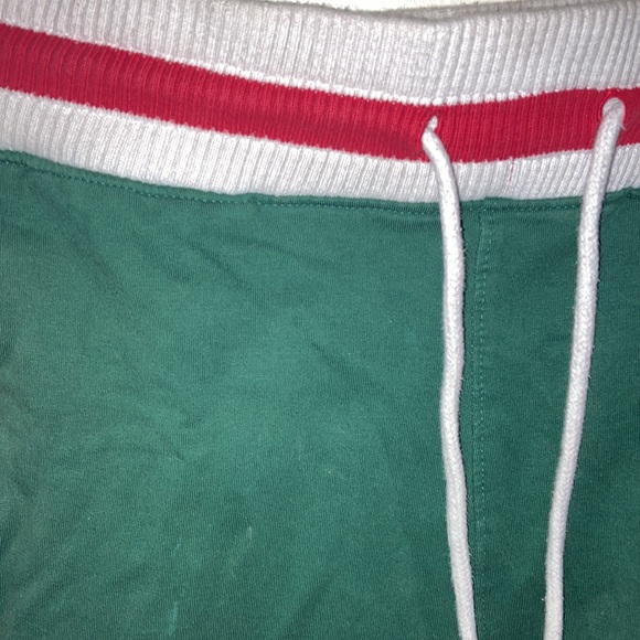 Green stretchy unisex shorts with red on both sides - Picture 2 of 3